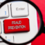 A snapshot of a keyboard with a large red key marked "fraud prevention"